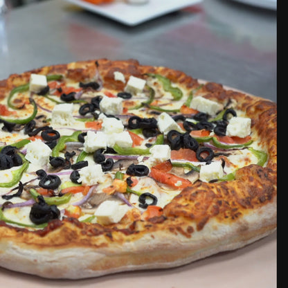 Pizza Athena (red onions, cheese, tomatoes, green peppers, black olives, feta cheese)